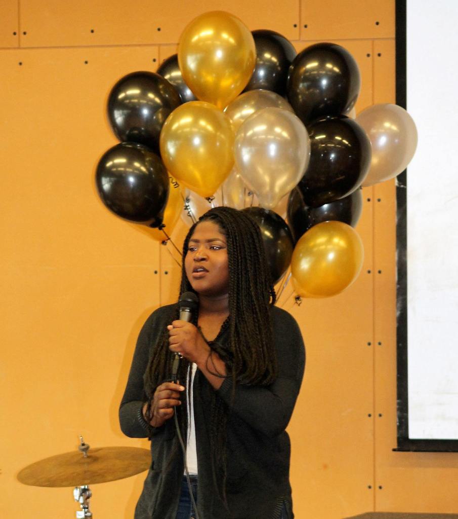 A student sings during the sixth annual Martin Luther King, Jr. Day event held at Todd Beamer High School. RAECHEL DAWSON, the Mirror