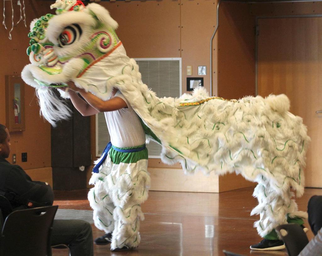 Students perform a Chinese dragon dance. RAECHEL DAWSON, the Mirror