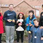 From left, Kristin Snapp, U.S.Apple Association representative and director of corporate affairs at Domex Superfresh Growers, Sherwood Forest Elementary P.E. Specialist Ryan Westhoff, Sherwood Forest Elementary fifth-grade scholars, Principal Alisa DeSart and Superintendent Tammy Campbell pose for a photo after a presentation announcing the school will receive $4,500 to expand its Apples for Education program to purchase apples for students and staff to eat every Monday, Wednesday and Friday. Photo courtesy Federal Way Public Schools