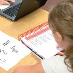 In this photo, a student&rsquo;s reading level is being assessed to develop a personalized learning plan for the student&rsquo;s literacy needs. Photo courtesy Federal Way Public Schools