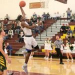 Federal Way forward Etan Collins lifts off for a dunk during the Eagles&rsquo; win over the Kentridge Chargers. JEROD YOUNG, the Mirror