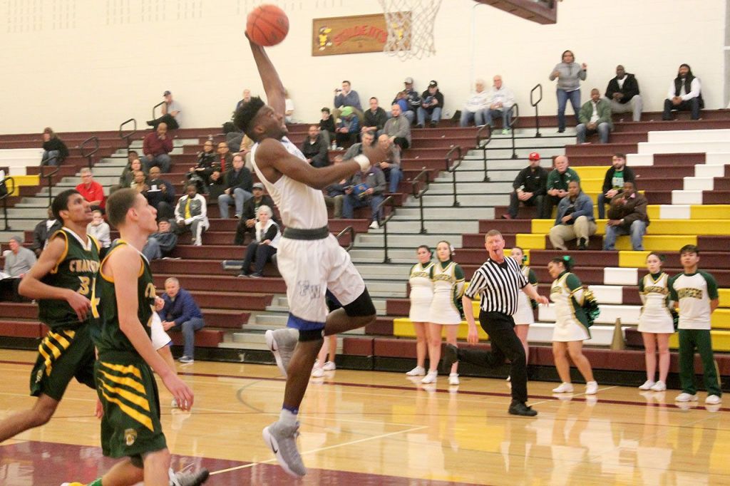 Federal Way forward Etan Collins lifts off for a dunk during the Eagles&rsquo; win over the Kentridge Chargers. JEROD YOUNG, the Mirror