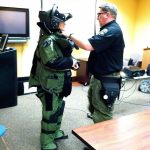 A participant of the Federal Way Police Department Citizens Police Academy tries on bomb-response gear at a past academy. The police department is currently accepting applications for this year&rsquo;s academy, which begins April 4 and runs for eight weeks. Contributed photo