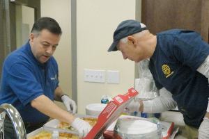 Rotary welcomes new neighbor with Super Bowl party