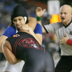 Federal Way girls wrestler Tally Thomas locks up in pursuit of winning the 2016 state title. Photo courtesy of Dennis Box