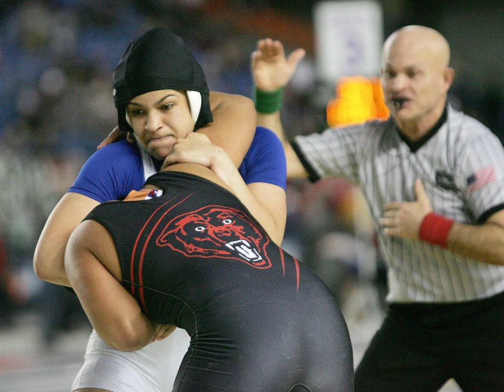 Federal Way girls wrestler Tally Thomas locks up in pursuit of winning the 2016 state title. Photo courtesy of Dennis Box