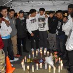 Wesley Gennings&rsquo; friends huddle around candles at a candlelight vigil on Monday night. RAECHEL DAWSON, the Mirror