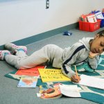 Aaliyah Motley, a student in Miranda Eller&rsquo;s third-grade class at Enterprise Elementary, reads a book about Cesar Chavez and takes notes on what she learned during reading time. Jessica Keller, the Mirror