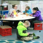 Enterprise Elementary third-grade teacher Miranda Eller works with some students during reading time, while other students read by themselves. Assessing students reading levels is much easier this year for Eller because of the new English-Language Arts curriculum adoption.
