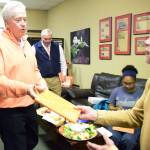 Federal Way business consultant and author Steve Miller, left, speaks with John Kurosky at a book signing for his seventh publication, &ldquo;Uncopyable: How to Create an Unfair Advantage Over Your Competition,&rdquo; Monday at Poverty Bay Coffee. Jessica Keller, the Mirror
