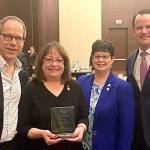 Susan Streifel, second from left, is presented with a plaque commemorating her induction into the Credit Union House Hall of Leaders by John Zmolek, president/ CEO of Verity Credit Union; Debie Keesee, president/CEO of Spokane Media FCU; and Troy Stang, president/CEO of the Northwest Credit Union Association. Contributed photo                                Susan Streifel, second from left, is presented with a plaque commemorating her induction into the Credit Union House Hall of Leaders by John Zmolek, president/ CEO of Verity Credit Union; Debie Keesee, president/CEO of Spokane Media FCU; and Troy Stang, president/CEO of the Northwest Credit Union Association. Contributed photo