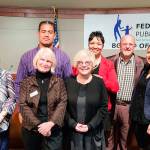 Students from Federal Way High School and Federal Way Public Academy presented the plan for scholar representation on the school board at a board meeting on Tuesday. The students and school board members are pictured above. Courtesy of Federal Way Public Schools