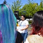 A Thomas Jefferson High School student recites a poem about cultural representation before the march began. RAECHEL DAWSON, the Mirror