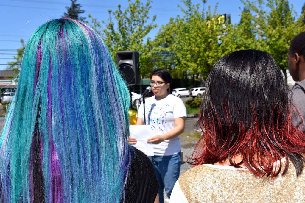A Thomas Jefferson High School student recites a poem about cultural representation before the march began. RAECHEL DAWSON, the Mirror