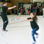 Lake Grove Elementary second-grader Mya Quichocho, 7, participates in her school&rsquo;s Jump Rope For Heart event as physical education teacher Dana Henry supervises the rest of the students. Jessica Keller, the Mirror