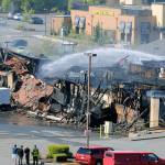 Firefighters spray down the remnants of a building in Center Plaza that was destroyed by a fire May 21 in Federal Way. Investigators from many agencies concluded their probe into what started the fire Wednesday unable to determine its cause. Photo courtesy of Shelley Pauls