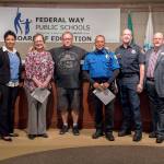 Superintendent Tammy Campbell, Valhalla Elementary Principal Kristen Schroeder, security officer Craig Plummer, lead security officer Parris Mamon, South King Fire & Rescue Capt. Jeff Bellinghausen and school board President Geoffery McAnalloy at the June 13 school board meeting where Schroeder and Mamon were honored. Courtesy of Federal Way Public Schools