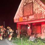 Firefighters battle fire at abandoned house on Military Road