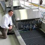 Lakehaven Water and Sewer general manager John Bowman kneels down near one of the UV light disinfection stations. RAECHEL DAWSON, the Mirror