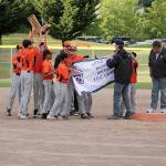 Federal Way Nation Little League 12U Giants players raise the championship trophy after defeating Steel Lake 7-4 Tuesday in the championship game of the Tournament of Champions. JEROD YOUNG, the Mirror