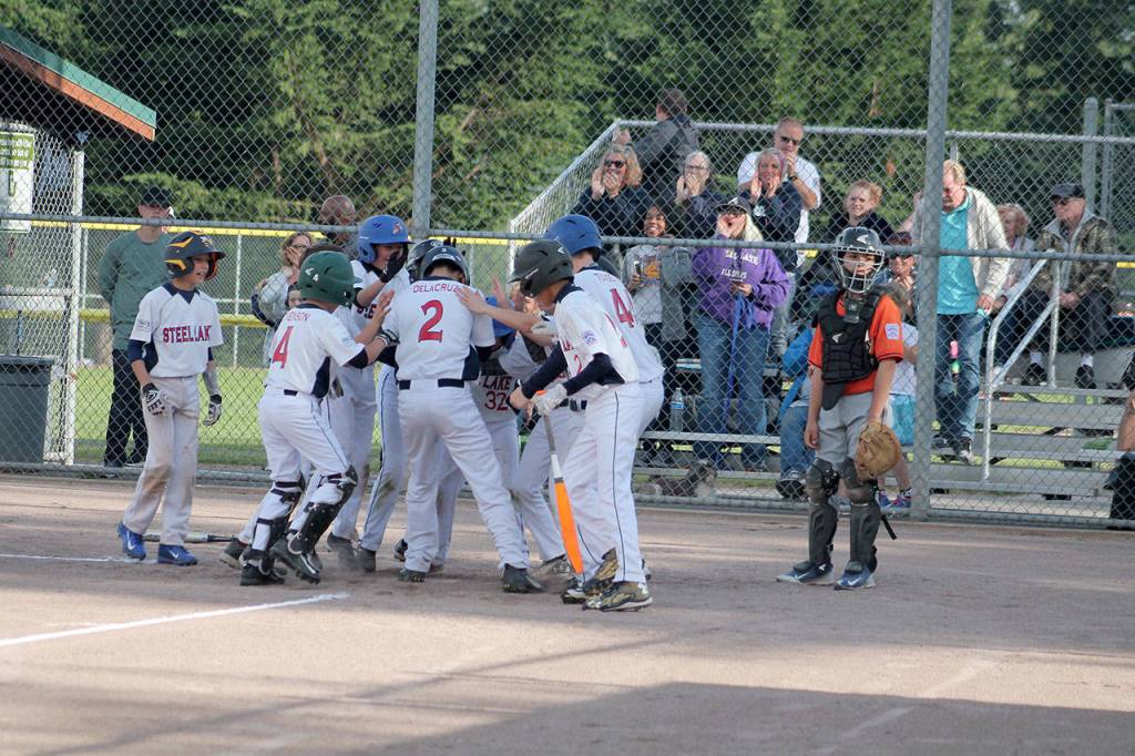 A three-run home run from Drew Delacruz gave the Steel Lake Little League 12U Braves a 4-0 lead in the top of the first inning of the championship game vs. the Federal Way Nation Little League Giants at the Tournament of Champions. JEROD YOUNG, the Mirror
