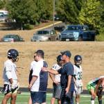 Beamer football coach Darren McKay helps run quarterback drills at the Titans&rsquo; practice Aug. 17. JEROD YOUNG, the Mirror