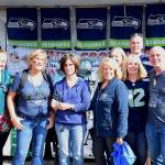 Shelley Pauls (center) received the Dick Mayer Community Service Award at the Federal Way Farmers Market&rsquo;s Chili Cook-off. Photo courtesy of Bruce Honda