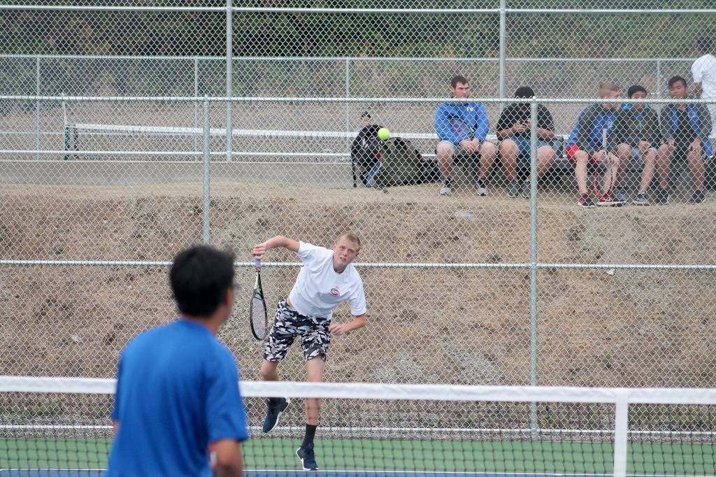 Because of his height, Jacob Buchan has proven to be a doubles team asset for Decatur tennis. JEROD YOUNG, the Mirror