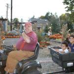 Jim Cox, project manager for Light of Christ Community Garden, gives children a hayride at the garden&rsquo;s pumpkin patch fundraiser. HEIDI SANDERS, the Mirror