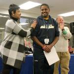 Federal Way Public Schools Superintendent Tammy Campbell, from left, congratulates Decatur High School English teacher James Diggins as School Board President Geoffery McAnalloy applauds at Tuesday&rsquo;s School Board meeting. Diggins was a recipient of the newly created &ldquo;Because of You&rdquo; award, which recognizes school district teachers and staff for their contributions and impacts they have in students&rsquo; lives. Other recipients were Angela Mattson, Lakota Middle School, Mindy Stagg, Sherwood Forest Elementary, Raisa Baker, Taf@Saghalie, Aaron Weed, Thomas Jefferson High School, Jamarkus Springfield, Thomas Jefferson High School, and Natalee Daniels, Camelot Elementary School. 
JESSICA KELLER, the Mirror