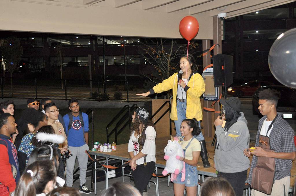 Jinyoung &ldquo;Audrey&rdquo; Yoon, a senior at Thomas Jefferson High School and co-chair of We Scare Hunger, polls the crowd to find a winner of the costume contest. HEIDI SANDERS, the Mirror