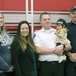 American Medical Response EMT Kristi Michaels, from left, Diane Kuo, paramedic Kyle Waterman, holding Kuo&rsquo;s daughter Kylie, and SKFR firefighter/EMT Randy White pose for a photo at a reception Monday at Station 62 in Federal Way. The reception was the first time since Kylie&rsquo;s birth April 6 that the first responders have seen the baby, whom they helped deliver. JESSICA KELLER, the Mirror