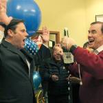 Federal Way Mayor Jim Ferrell celebrates as King County Councilman Pete Von Reichbauer pops the cap off a bottle of sparkling apple cider at a non-partisan election night gathering at KOAM television station. Ferrell is looking forward to his second term as mayor after receiving 5,379 votes to his opponent Susan Honda&rsquo;s 3,274 based on early election results Tuesday night. JESSICA KELLER, the Mirror