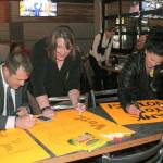 Federal Way Public Schools staff and supporters sign posters thanking voters for their support of the $450 million construction bond at a gathering hosted by Citizens For Federal Way Schools Nov. 7. While the fate of the bonds passage remained uncertain at the end of the night, results by King County Elections released Friday indicated the number of ballots required for the bond measure to be counted met the 21,301 threshold, and more than 60 percent of those votes were in favor. As of Monday, the district still has the super-majority of votes needed for the bond to pass. JESSICA KELLER, the Mirror