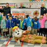 SKFR firefighters present young Mirror Lake students with coats for winter