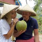 Liana and Alex Borishkevich drink from a coconut in Bali, Indonesia. Alex, a 2005 Decatur High School graduate, and his wife, Liana, quit their jobs earlier this year to travel the world. Courtesy Liana and Alex Borishkevich