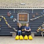 Liana and Alex Borishkevich try on wooden shoes in the Netherlands. The couple chronicles their world travel on their blog, Acouplesworldtour.com. Courtesy Liana and Alex Borishkevich