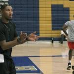 First-year Decatur boys basketball coach Jeffery Forbes guides his team during a practice drill. Forbes, who teaches marketing at Decatur, graduated from Federal Way High School in 2009, when he helped guide the Eagles to a 4A state championship title. Forbes replaces former coach David Choi. JESSICA KELLER, the Mirror