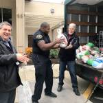 Volunteers load frozen turkeys into a truck during the Big Ol Turkey Round Up at Brooklake Church last Sunday. The event collected 323 turkeys which will be given to those in need. Courtesy Shelley Pauls