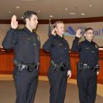 From left, officers Joseph Rodriquez, Truitt Hartle and Luis Deffit take the oath of office at the Nov. 21 Federal Way City Council meeting. Heidi Sanders, the Mirror