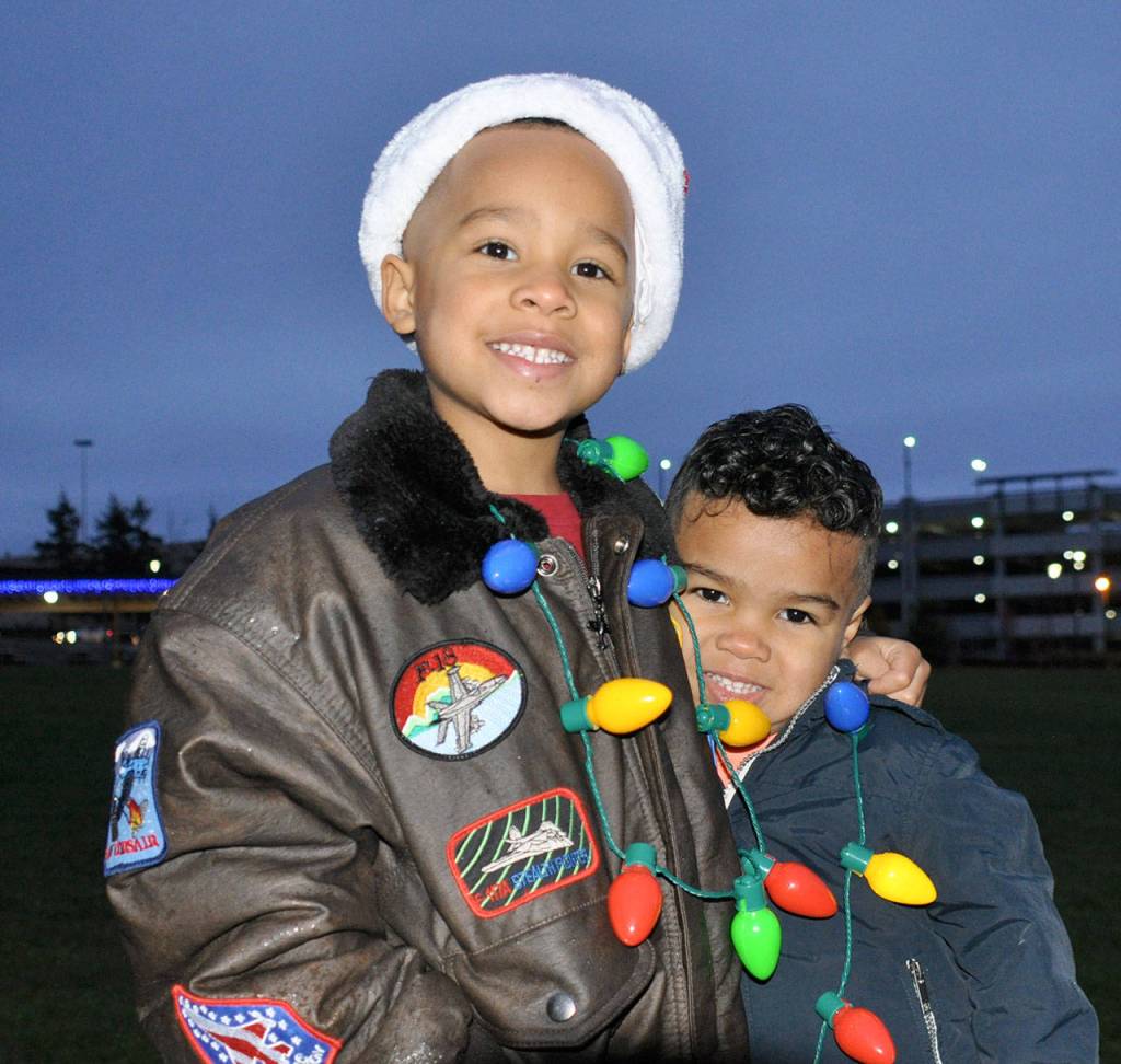 Zion, 5, and Jalen, 3, get in to the holiday spirit during the tree lighting ceremony. Heidi Sanders, the Mirror