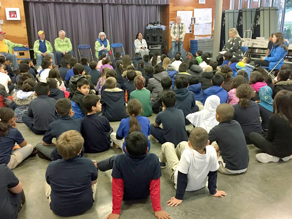 Lions Club presents district third-graders with dictionaries