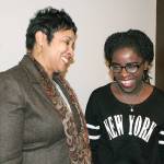Federal Way Public Schools Superintendent Dr. Tammy Campbell, left, and Phiona Mutesi, a young Ugandan woman who gained international acclaim as a chess champion, share a laugh before a Chess with the Superintendent event at Family Life Community Church Wednesday. Mutesi, who was invited to attend by congregation members who are classmates of hers at Northwest University, offered tips to students during the session. Afterward she spoke to them of her life experiences, featured in the movie, Queen of Katwe. JESSICA KELLER, the Mirror