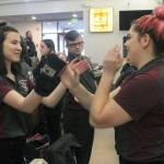 Thomas Jefferson bowlers Whitney Lee, left, and Abbie Harris celebrate with hand claps following a strike by Harris in their match against Decatur Wednesday. Jessica Keller, the Mirror
