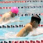 Todd Beamers Brendan Man maintains a narrow lead over Auburns Ryan Odell in the 100-yard breastroke in their league meet Tuesday at the Weyerhaeuser King County Aquatic Center. Man, who has already qualified for state in the 100 butterfly, held off Odell to take first in the event. Jessica Keller, the Mirror