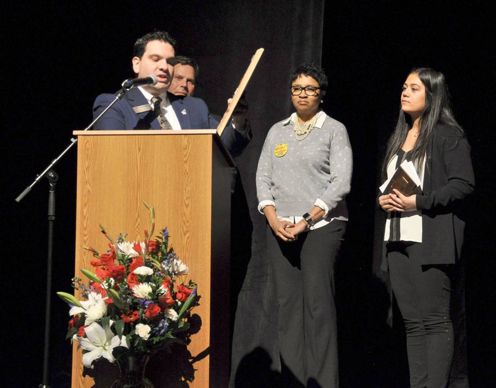 Federal Way City Councilman Martin Moore, left, presents Decatur High School junior Aliyah Baruso, right, with the Rep. Roger Freeman Award, as Mayor Jim Ferrell and Federal Way Public Schools Superintendent Tammy Campbell look on. Heidi Sanders, the Mirror