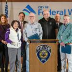 Members of the city of Federal Ways Cart Recovery Team recently received the Police Chiefs Citizen Citation Award for their work retrieving abandoned shopping carts and returning them to their retail owners. From left, are Deputy Chief Steve Neal, Federal Way Police Department spokeswoman Cathy Schrock, CRT member Mari Ikeda-Gomes, Mayor Jim Ferrell, CRT member Tim Lehnherr, Deputy Chief Kyle Sumpter, CRT member John McMahon and Chief Andy Hwang. Courtsey Federal Way Police Department
