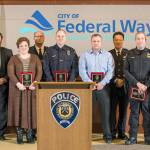 The Federal Way Police Department recently presented its annual awards including Employee of the Year honors. From left are Employee of the Year Awards: Federal Way Police Department spokeswoman Cathy Schrock, Mayor Jim Ferrell, Civilian Employee of the Year recipient Marie Byer, Deputy Chief Steve Neal, Officer of the Year Corporal Steve Wortman, Detective of the Year Mike Coffey, Chief Andy Hwang, Supervisor of the Year Lt. Keith Schmidt, Deputy Chief Kyle Sumpter and MVP of the Year officer Tyler Turpin. Courtesy Federal Way Police Department