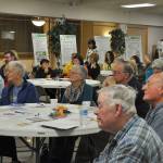 Community members celebrate the Federal Way Day Centers first anniversary on Thursday evening at St. Vincent De Pauls social hall. Heidi Sanders, the Mirror