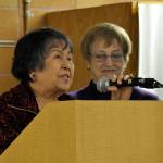 Rufina Jordan, left, who has volunteered more than 700 hours at the Federal Way Day Center, receives recognition for her service during the centers first anniversary celebration. Heidi Sanders, the Mirror